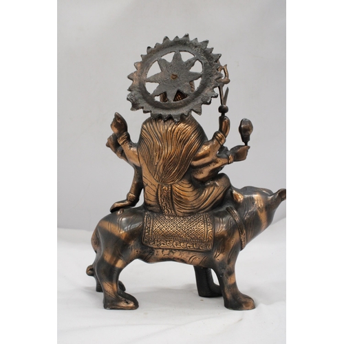 209 - A BRONZE EXOTIC INDIAN MOTHER GODDESS ON A TIGER'S BACK, HEIGHT 38CM, LENGTH 28CM