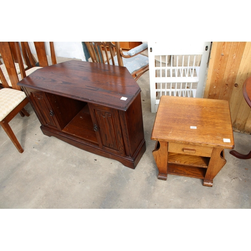 2850 - AN OAK MAGAZINE RACK / TABLE AND OAK JAYCEE TELEVISION STAND WITH LINENFOLD SLIDING DOORS