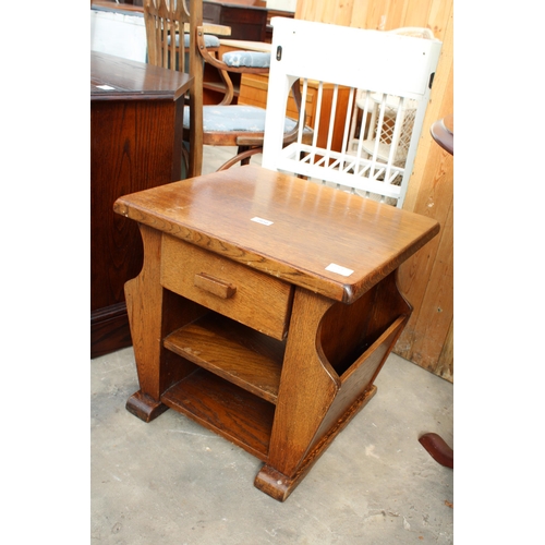 2850 - AN OAK MAGAZINE RACK / TABLE AND OAK JAYCEE TELEVISION STAND WITH LINENFOLD SLIDING DOORS