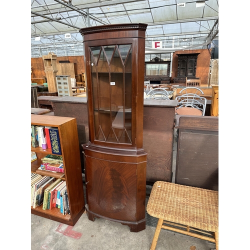 2904 - A MODERN CORNER CUPBOARD WITH GLAZED UPPER PORTION