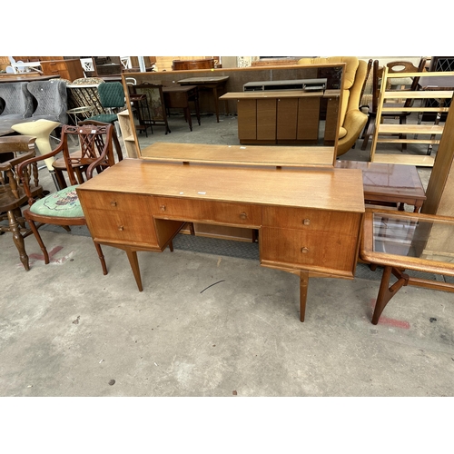 2912 - A MCINTOSH RETRO TEAK DRESSING TABLE ENCLOSING FIVE DRAWERS, 55.5