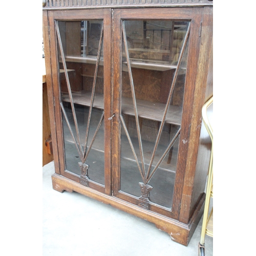 2953 - AN EARLY 20TH CENTURY OAK TWO DOOR GLAZED BOOKCASE, 36