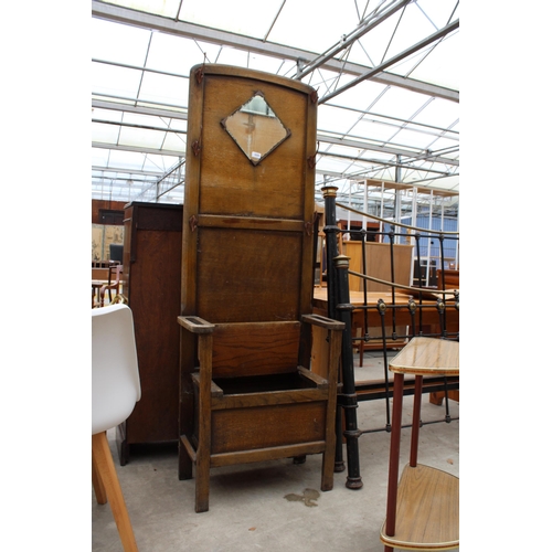 3009 - A MID TWENTIETH CENTURY OAK MIRRORED HALL STAND AND DEMI-WINE HALL TABLE