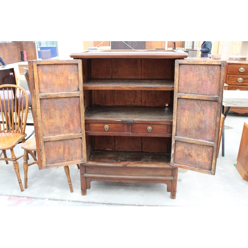 3022 - A CHINESE ELM TAPERING TWO DOOR CABINET WITH BRASS HANDLES AND LOCK WITH TWO INTERNAL DRAWERS, 36