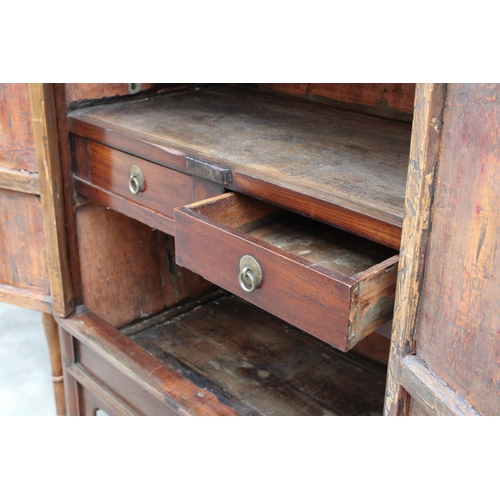 3022 - A CHINESE ELM TAPERING TWO DOOR CABINET WITH BRASS HANDLES AND LOCK WITH TWO INTERNAL DRAWERS, 36