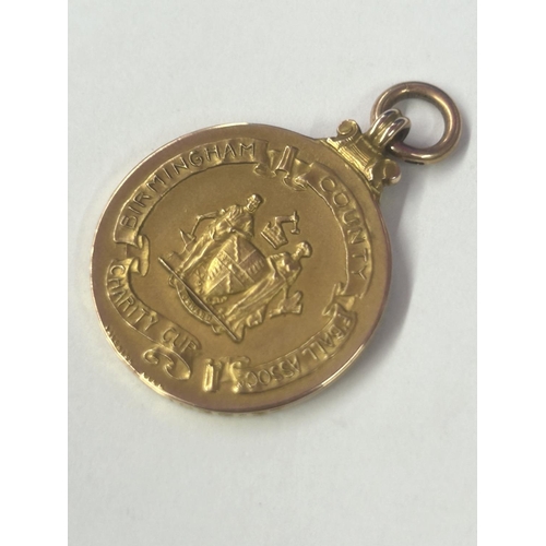 7 - A HALLMARKED 9 CARAT GOLD BIRMINGHAM COUNTY FOOTBALL ASSOCIATION CHARITY CUP JOINT WINNERS MEDAL 193... 