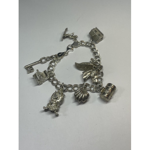 524 - A SILVER CHARM BRACELET