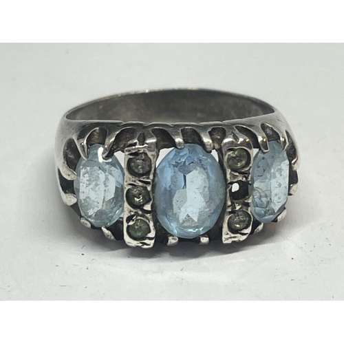 532 - A SILVER DRESS RING WITH COLOURED STONES