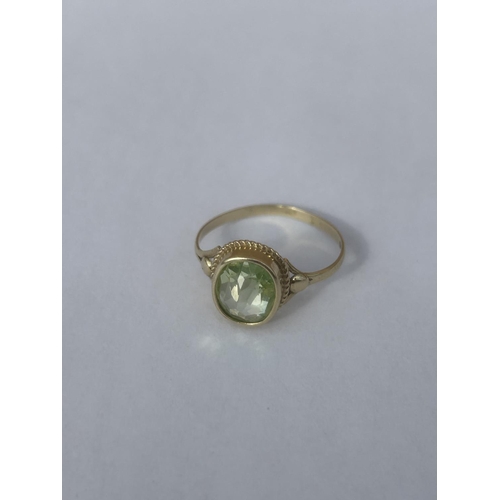 503 - A 14CT GOLD RING WITH A PERIDOT GEMSTONE, SIZE N, WEIGHT 1.65 G