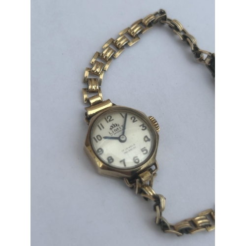 514 - A 9CT GOLD CASED LADIES LIMIT OF SWITZERLAND WATCH, WITH 17 JEWEL MOVEMENT