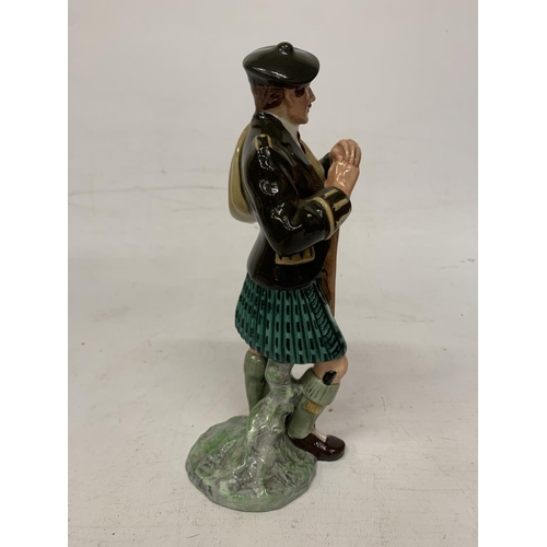 715 - A ROYAL DOULTON FIGURE 