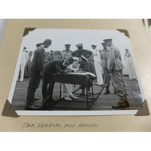 320A - A WORLD WAR II PHOTOGRAPH ALBUM CONTAINING PHOTOGRAPHS OF THE JAPANESE SIGNING OF THE INSTRUMENT OF ... 