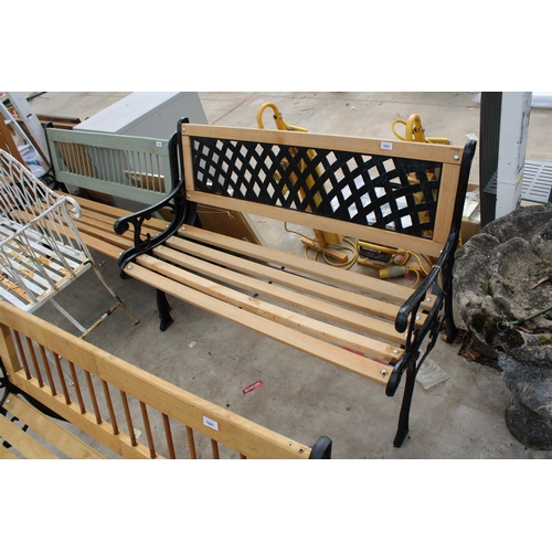 1763 - A WOODEN SLATTED GARDEN BENCH WITH CAST BENCH ENDS AND METAL LATTICE BACK