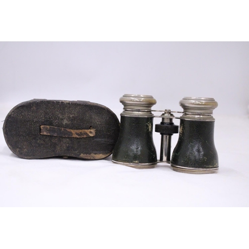 110 - A PAIR OF VINTAGE CASED VINTAGE BINOCULARS