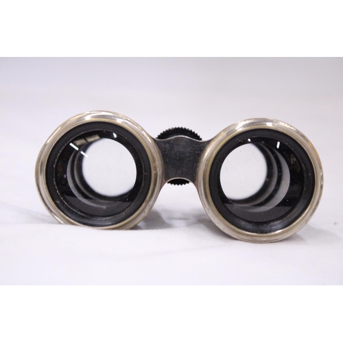 110 - A PAIR OF VINTAGE CASED VINTAGE BINOCULARS