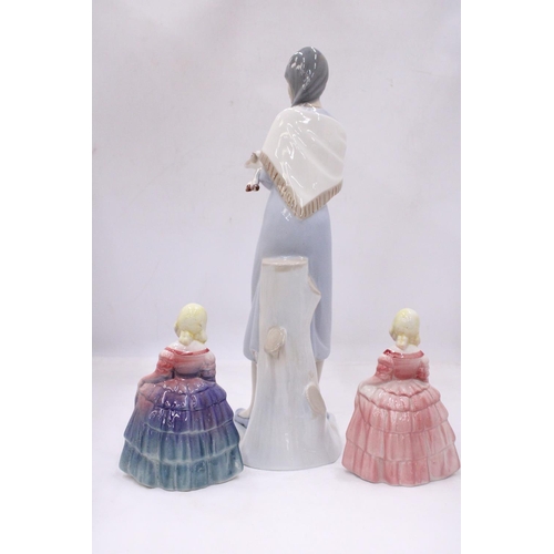 117 - A LLADRO STYLE LADY FIGURE HOLDING A LAMB 38CM TALL, PLUS TWO ROYAL DOULTON STYLE FIGURES