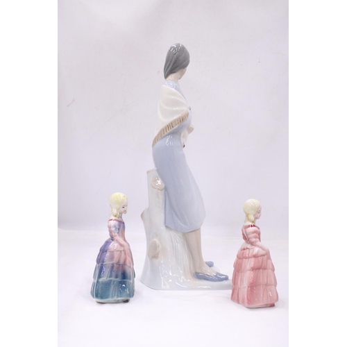 117 - A LLADRO STYLE LADY FIGURE HOLDING A LAMB 38CM TALL, PLUS TWO ROYAL DOULTON STYLE FIGURES