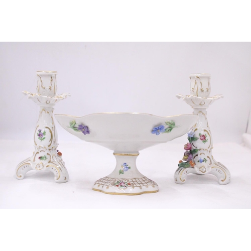 128 - A VINTAGE FLORAL COMPOTE PLUS A PAIR OF PORCELAIN CANDLESTICKS