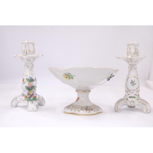 128 - A VINTAGE FLORAL COMPOTE PLUS A PAIR OF PORCELAIN CANDLESTICKS