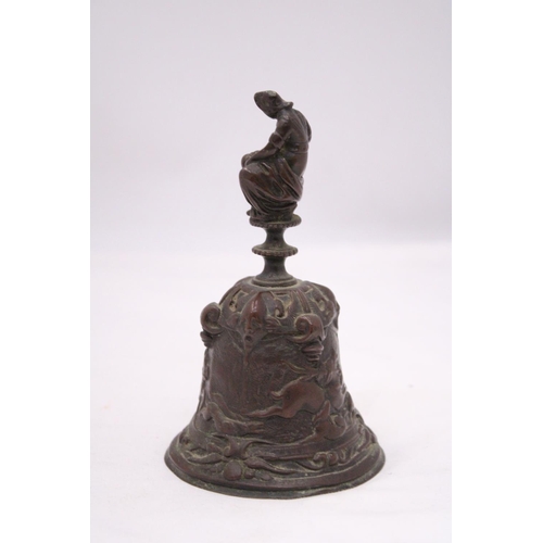 149 - A ORIENTAL BRONZE BELL DEPICTING A HUNTING SCENE AROUND BASE OF BELL