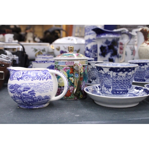 160 - A LARGE QUANTITY OF ORIENTAL STYLE BLUE AND WHITE TO INCLUDE CUPS,SAUCERS,SIDE PLATES PLUS A JUG AND... 