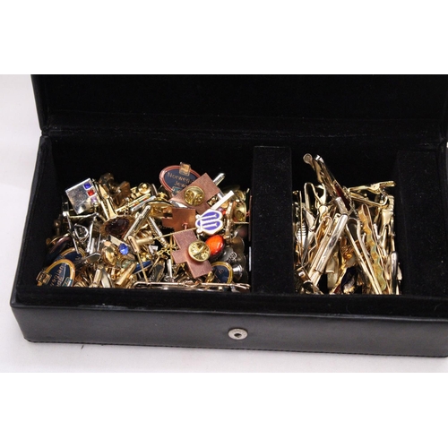 166 - A LEATHER BOX OF TIE STUDS