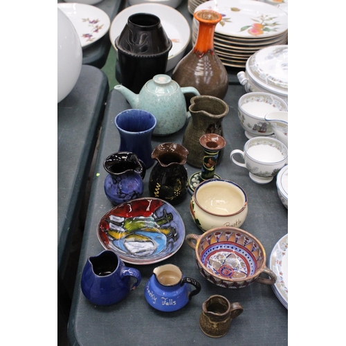 169 - A QUANTITY OF STUDIO POTTERY TO INCLUDE A TEAPOT, CANDLE HOLDER, BOWLS ETC - SOME WITH MARKS TO THE ... 