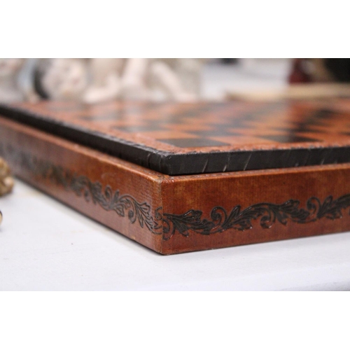 181 - A LEATHERBOUND CHESS BOARD WITH METAL CHESS PIECES - COMPLETE