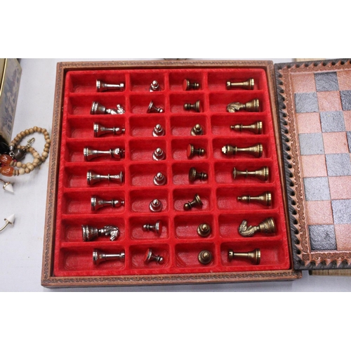 181 - A LEATHERBOUND CHESS BOARD WITH METAL CHESS PIECES - COMPLETE