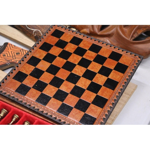 181 - A LEATHERBOUND CHESS BOARD WITH METAL CHESS PIECES - COMPLETE