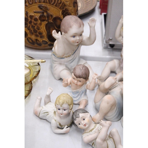 182 - THREE LARGE AND FOUR SMALL ANTIQUE PORCELAIN, BISQUE DOLLS