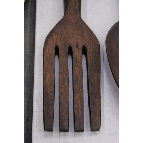 218 - TWO LARGE WOODEN WALL DECORATIONS OF A FORK AND SPOON