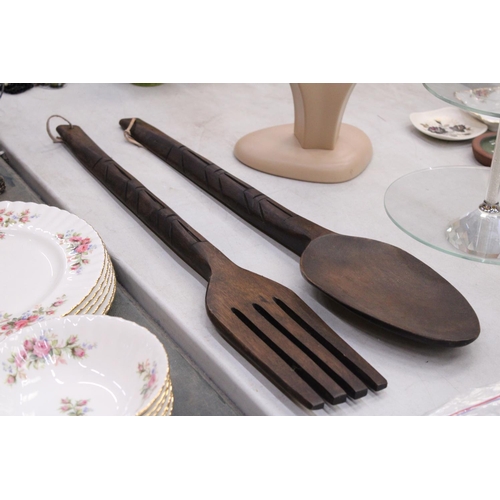 218 - TWO LARGE WOODEN WALL DECORATIONS OF A FORK AND SPOON