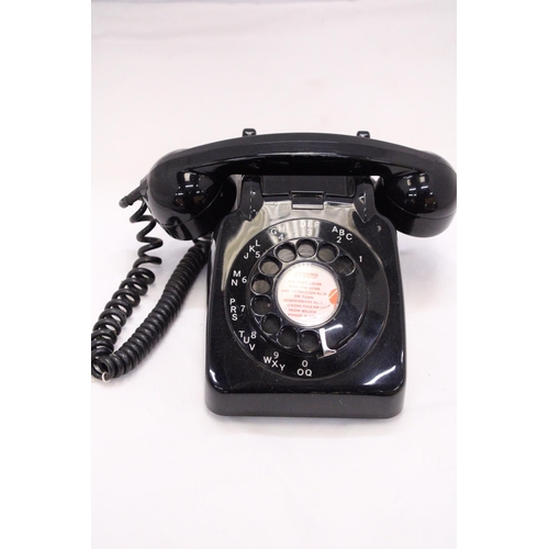 262 - A VINTAGE BLACK TELEPHONE WITH DIAL