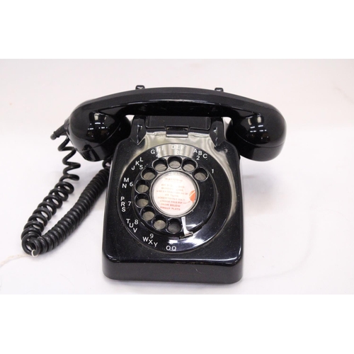 262 - A VINTAGE BLACK TELEPHONE WITH DIAL