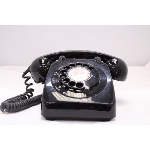 262 - A VINTAGE BLACK TELEPHONE WITH DIAL