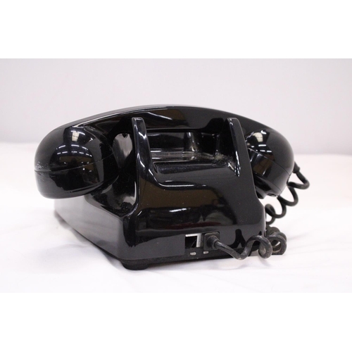 262 - A VINTAGE BLACK TELEPHONE WITH DIAL