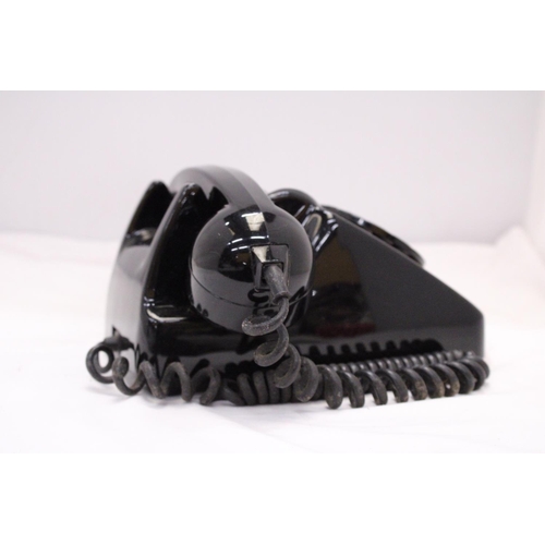 262 - A VINTAGE BLACK TELEPHONE WITH DIAL