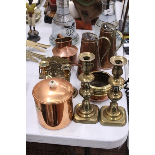 265 - A MIXED LOT OF COPPER AND BRASSWARE TO INCLUDE CANDLE STICKS, WATERING CAN ETC