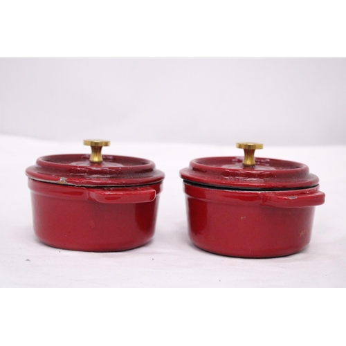 279 - TWO MINI CAST IRON LIDDED COOKING POTS