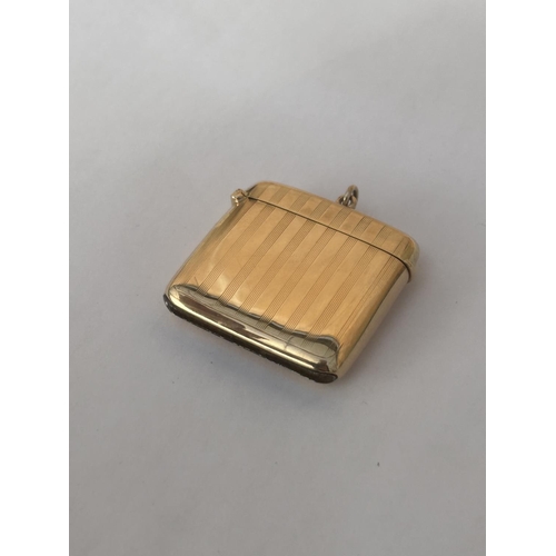 510A - A 9CT GOLD FULLY HALLMARKED ENGINE TURNED VESTA CASE WITH FLIP TOP COVER & SUSPENSION LOOP WEIGHT 21... 