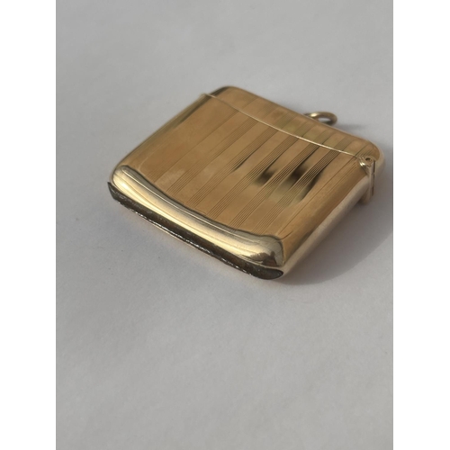 510A - A 9CT GOLD FULLY HALLMARKED ENGINE TURNED VESTA CASE WITH FLIP TOP COVER & SUSPENSION LOOP WEIGHT 21... 