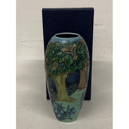 749 - A BOXED MOORCROFT VASE 