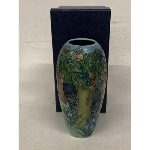 749 - A BOXED MOORCROFT VASE 