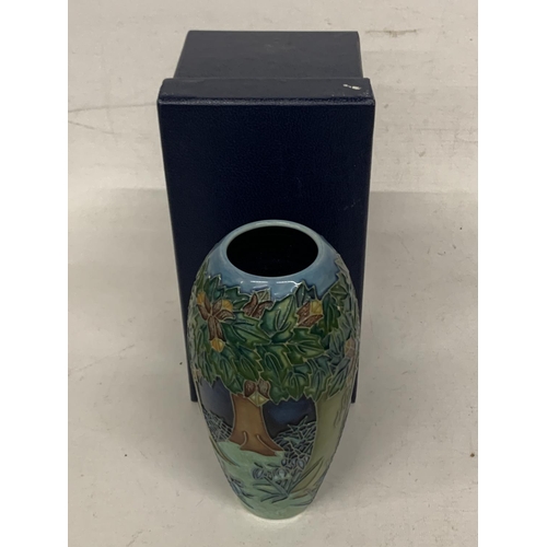 749 - A BOXED MOORCROFT VASE 