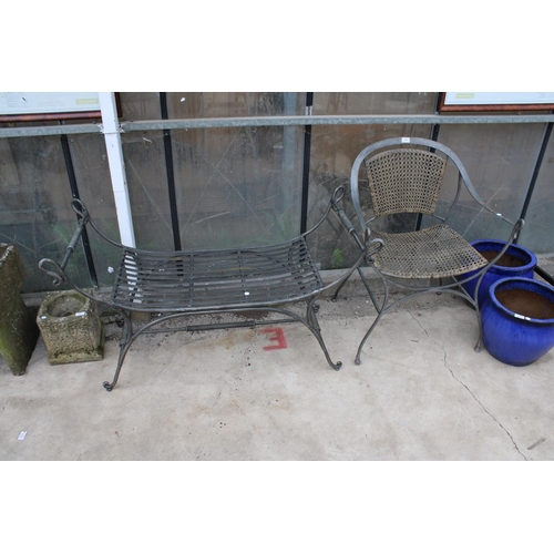 1514 - A METAL GARDEN CHAIR WITH RATTAN SEAT AND BACK AND A SIMILAR HEAVY METAL BENCH