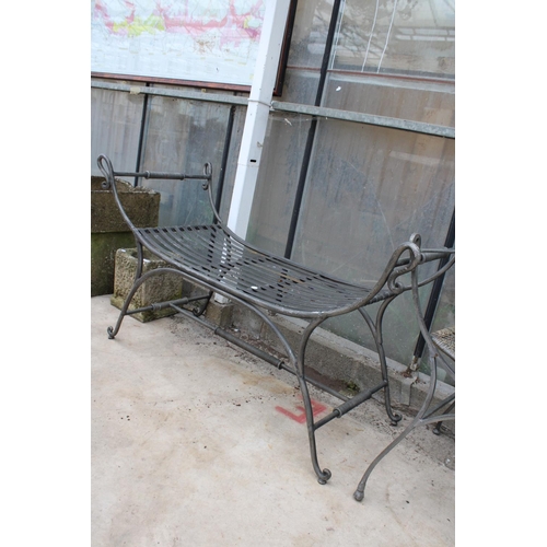 1514 - A METAL GARDEN CHAIR WITH RATTAN SEAT AND BACK AND A SIMILAR HEAVY METAL BENCH