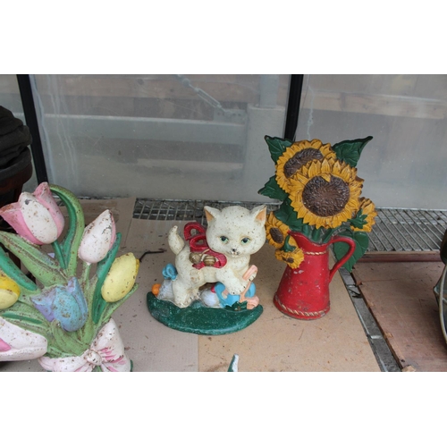 1564 - FOUR VARIOUS VINTAGE CAST IRON DOOR STOPS TO INCLUDE CATS AND FLOWERS ETC