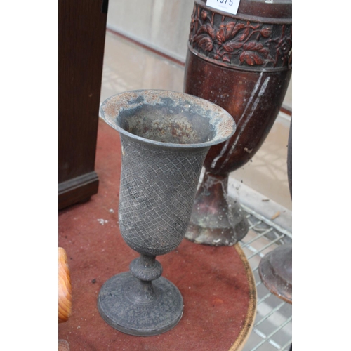 1575 - A PAIR OF ORNATE AND DECORATIVE COPPER URNS AND A A FURTHER SILVER PLATED URN