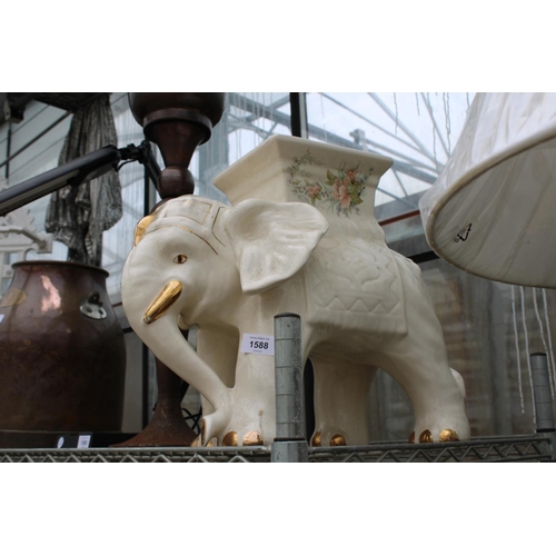 1588 - A DECORATIVE CERAMIC ELEPHANT JARDINAIRE STAND